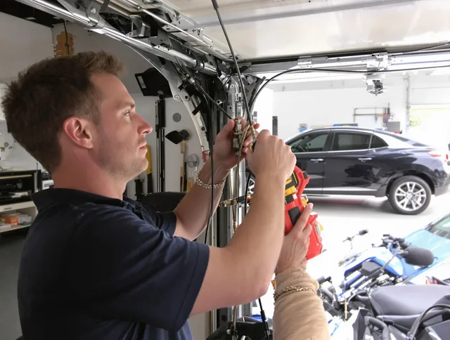 Trumbull Garage Door Repair safety certified technician performing cable replacement in Trumbull