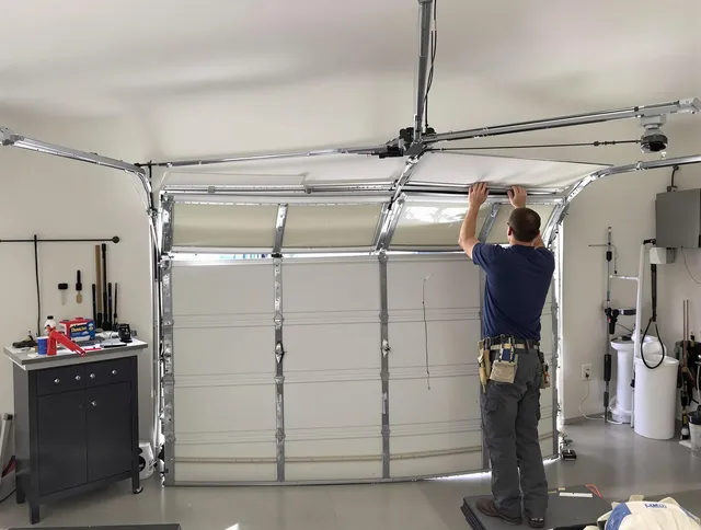 Trumbull Garage Door Repair specialist performing precise section replacement on Trumbull garage door