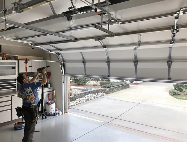 Garage door track repair service by Trumbull Garage Door Repair in Trumbull